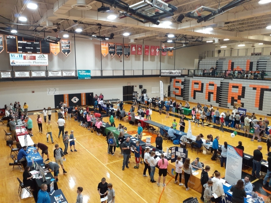 image of a gym with tables and people